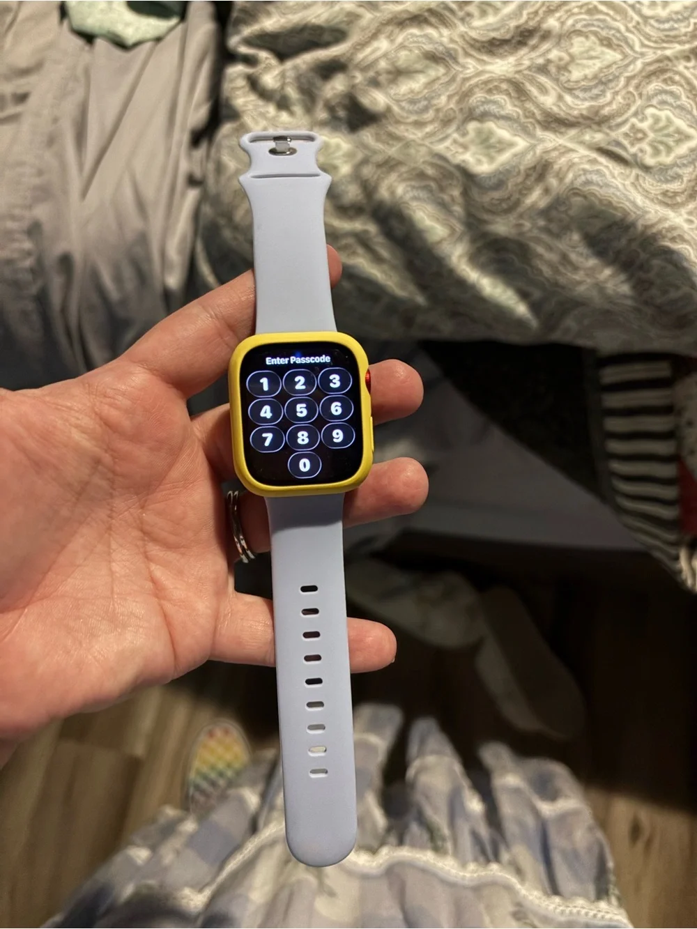 Apple Smartwatch with bag of watch covers and bands and charger.